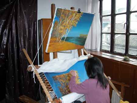 A worker at the Embroidery Institute