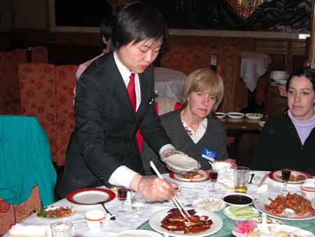 Waitress serving Peking Duck